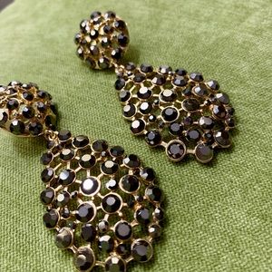 Statement earrings in gold and black crystals